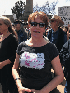 Debbie Michelson wears her creative T-shirt at the Santa Fe rally for gun safety.